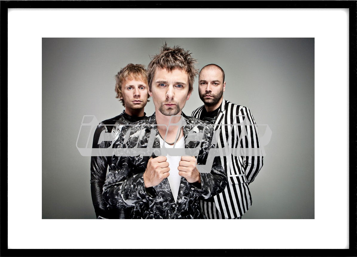 MUSE - L-R: Dominic Howard, Matthew Bellamy, Christopher Wolstenholme - Exclusive Portraits of Muse in Manchester UK - Sep 3, 2010. Photo credit: Ashley Maile / IconicPix