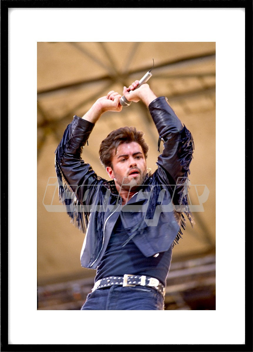WHAM! - singer George Michael performing live at WHAM!'s Final Concert in front of an audience of 72,000 people at Wembley Stadium London UK on 28 June1986. Photo: © PG Brunelli/IconicPix