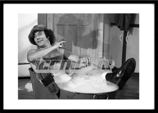 AC/DC - An exclusive photograph of Brian Johnson in a bath tub during filming of the video for "You Shook Me All Night Long" in London UK - 1986. Photo: © George Bodnar Archive/IconicPix